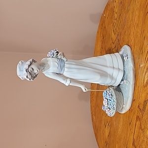 Lladro "Girl pulling basket of wild flowers